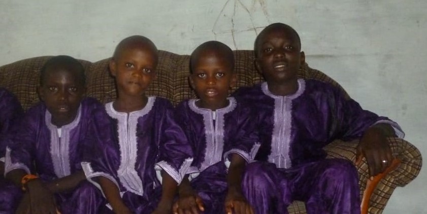 a picture of me Kemo, Abdullah, Tayyip and Musa in the year 2011 wearing our traditional african clothes.